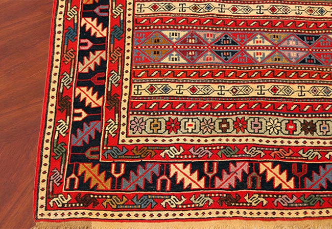 afgan rug on wood floor rug cleaning service