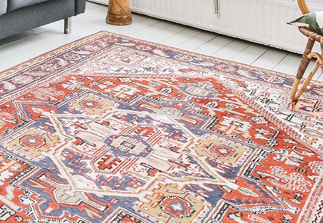 living room clean indian rug with gray sofa