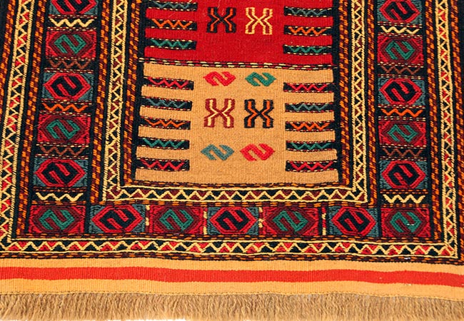 old and modern colourful afgan rug with the pattern afgan rug cleaning