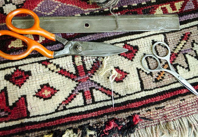 rug on floor with repair equipment rug repair service