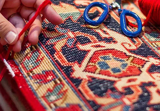 Workers are repairing the rug. 